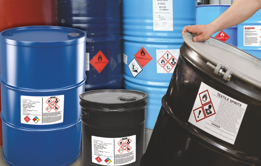A chemical drums that is handled by humans