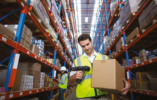 Man using barcode printer for logistics and warehouse