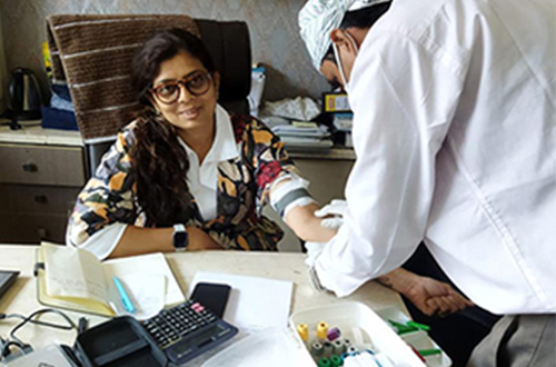 Woman giving hand for blood test